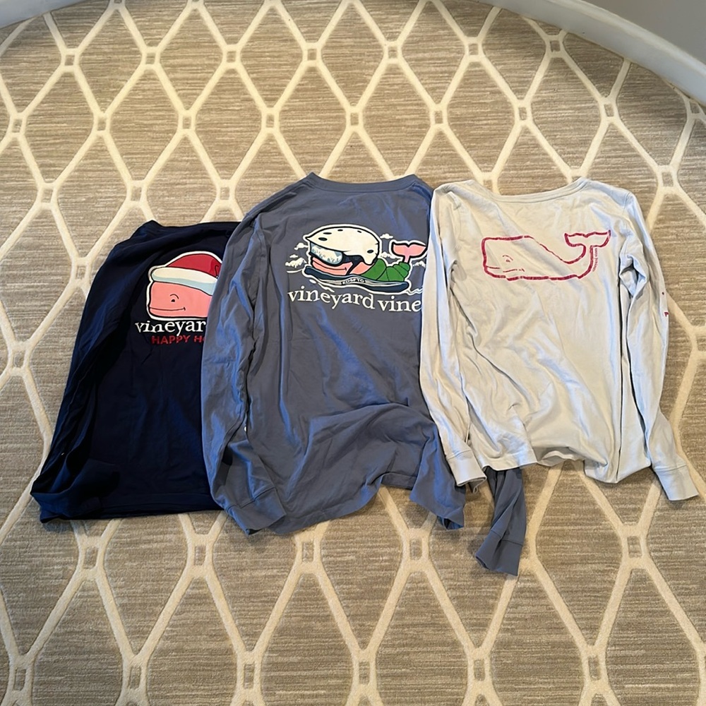 White- has a pink whale XS light blue- has a skiing whale M dark blue- whale S